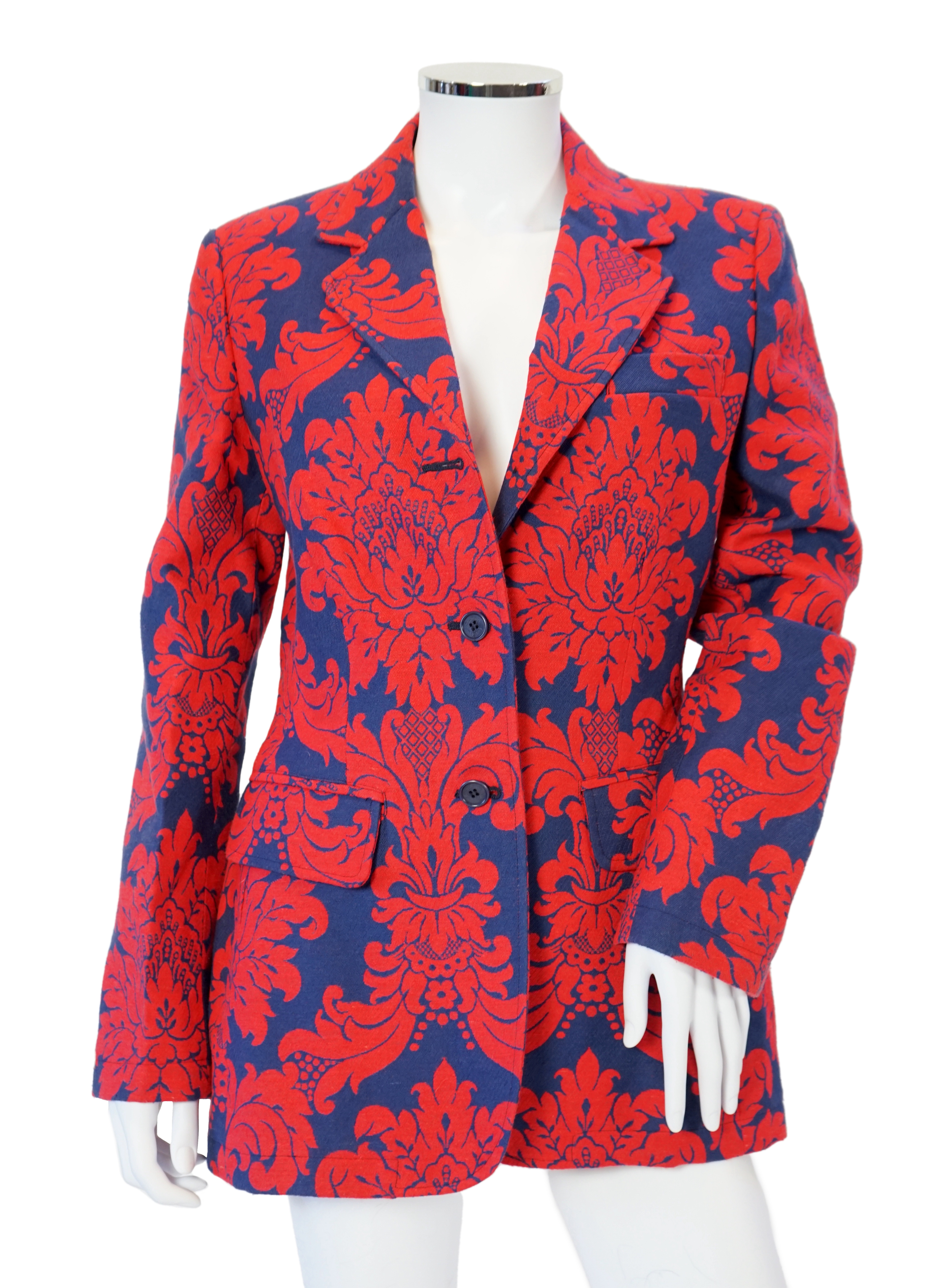 A Moschino lady's long blue and red jacket, a cream cotton embellished blazer and a cotton pair of floral trousers, blue and red jacket size 14, cream blazer size 12, trousers size: 10